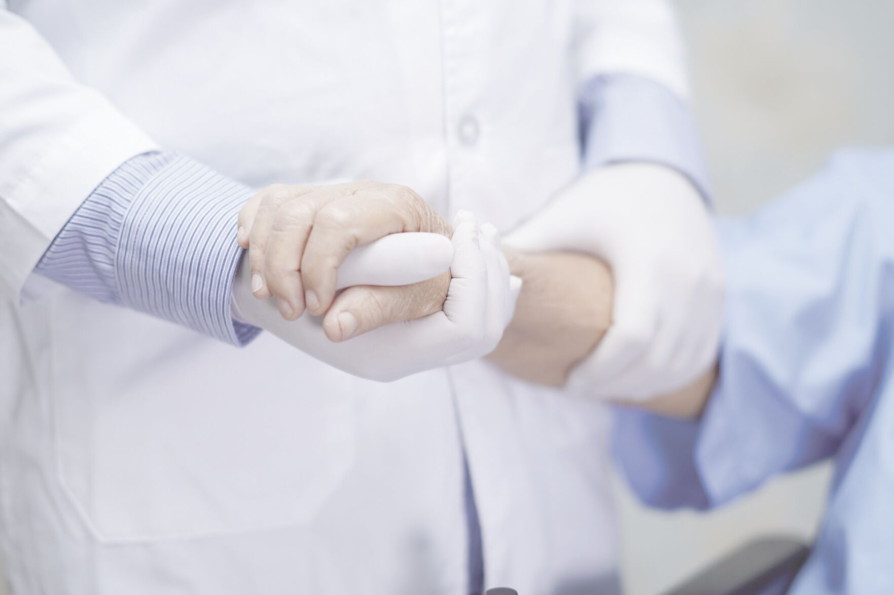 stock photo Doctor holding touching hands